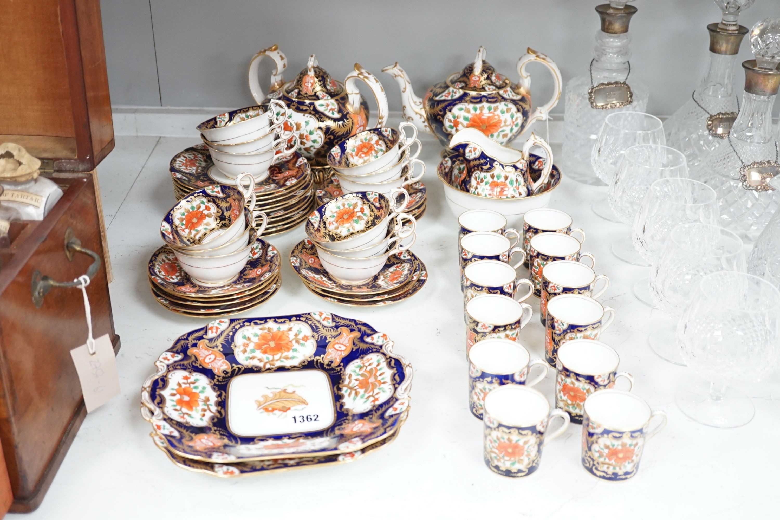 A mid 19th century English bone china fifty-two piece part tea and coffee service, decorated in an Imari pattern